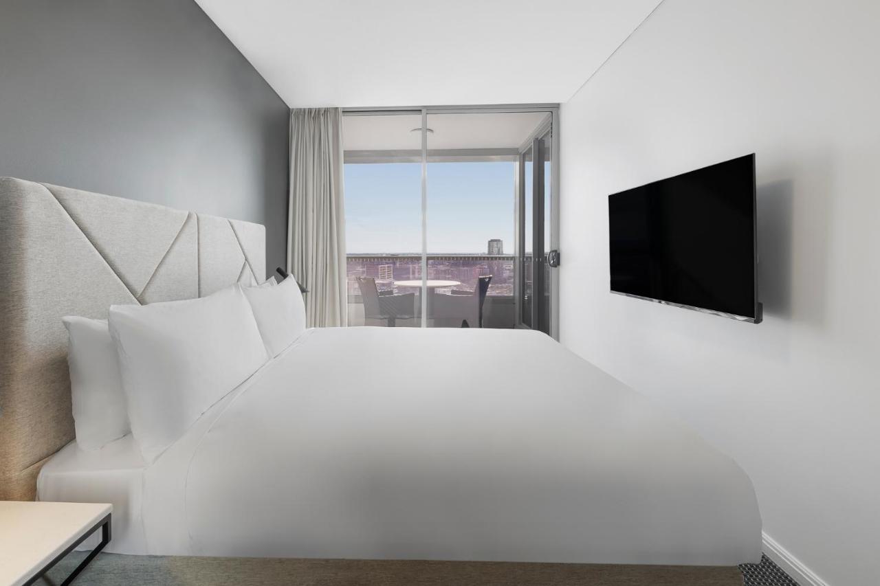 Meriton Suites Zetland Sidney Exterior foto A bedroom at the hotel